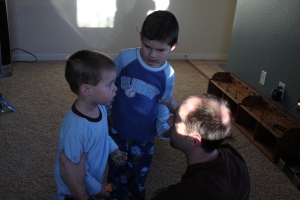 Daddy telling the boys that Santa left one more present downstairs.